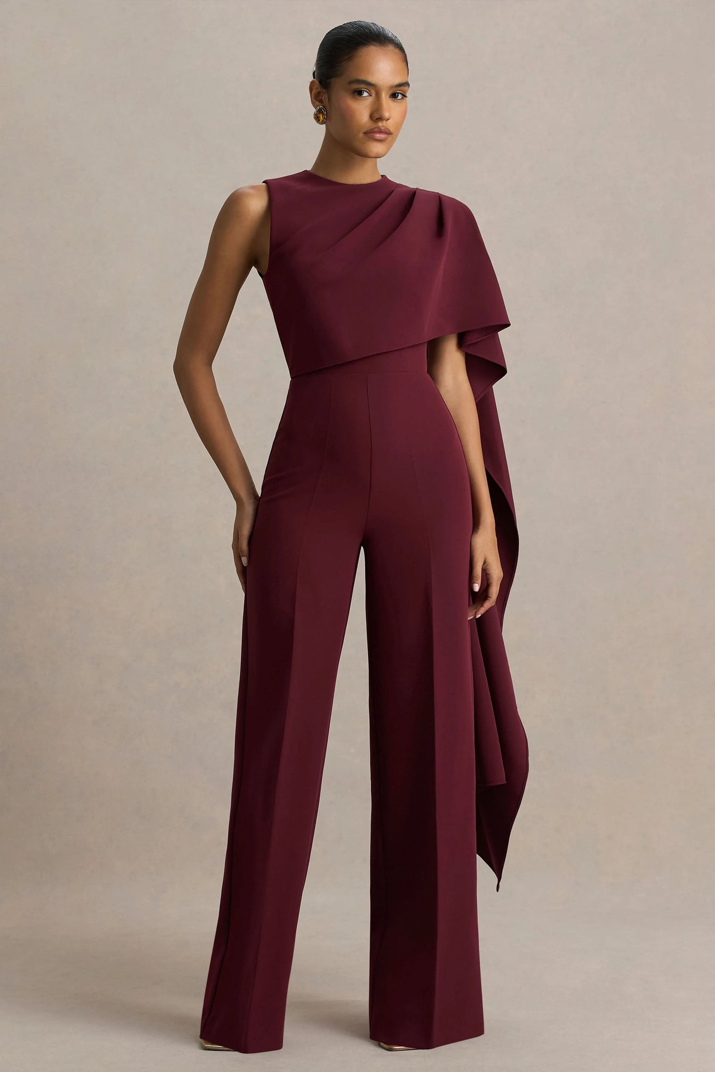 Sorenia Burgundy High-Neck Jumpsuit With One-Cape Sleeve
