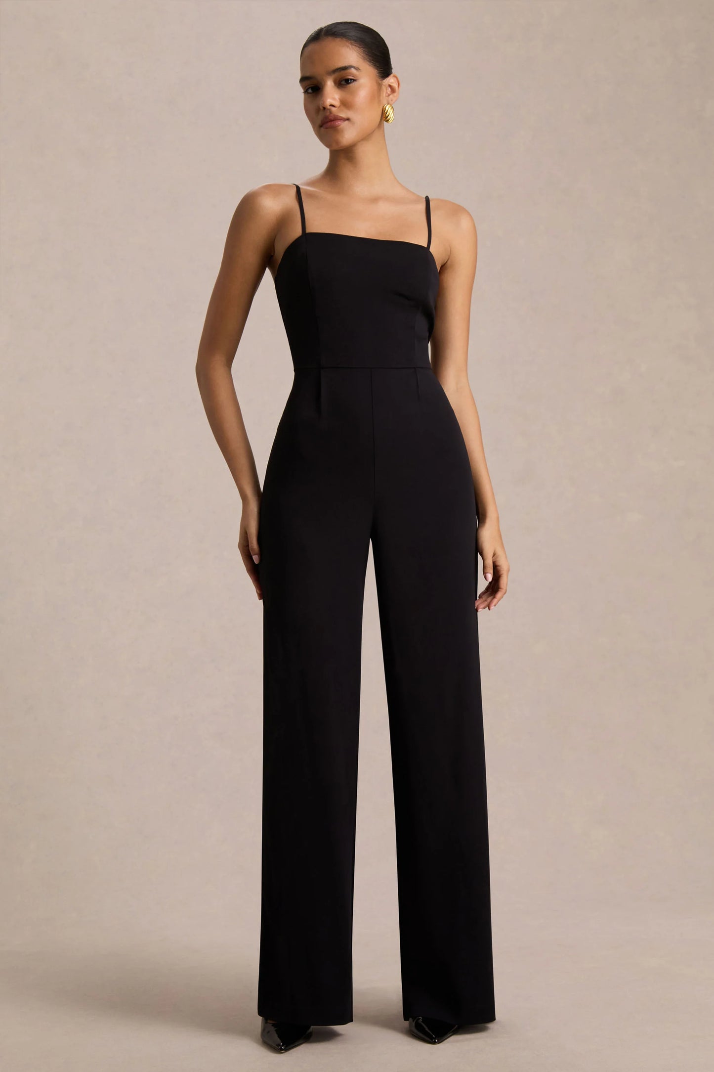 Raquel Black Asymmetric-Neck Jumpsuit With Twisted Cape Detail
