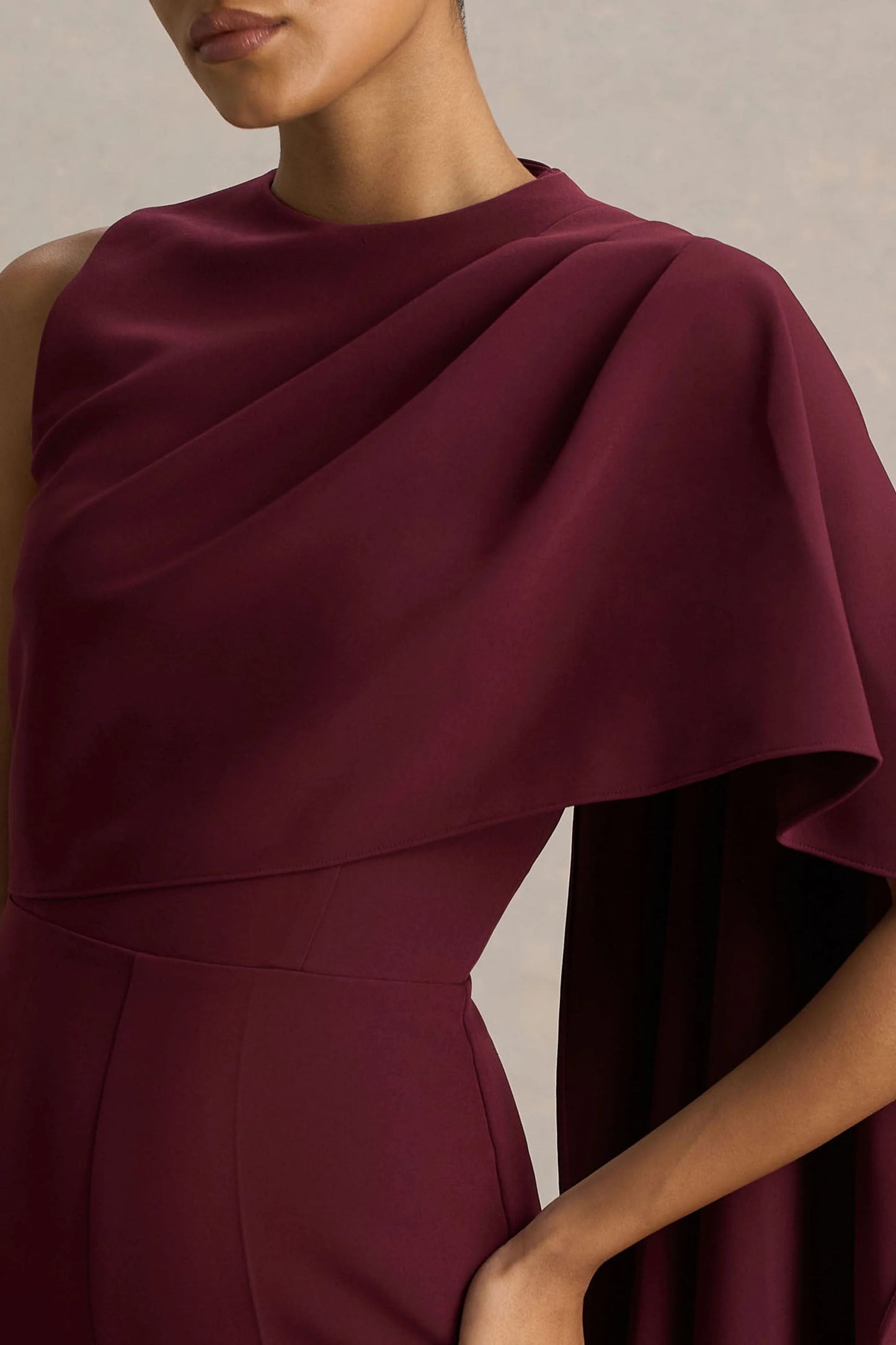 Sorenia Burgundy High-Neck Jumpsuit With One-Cape Sleeve