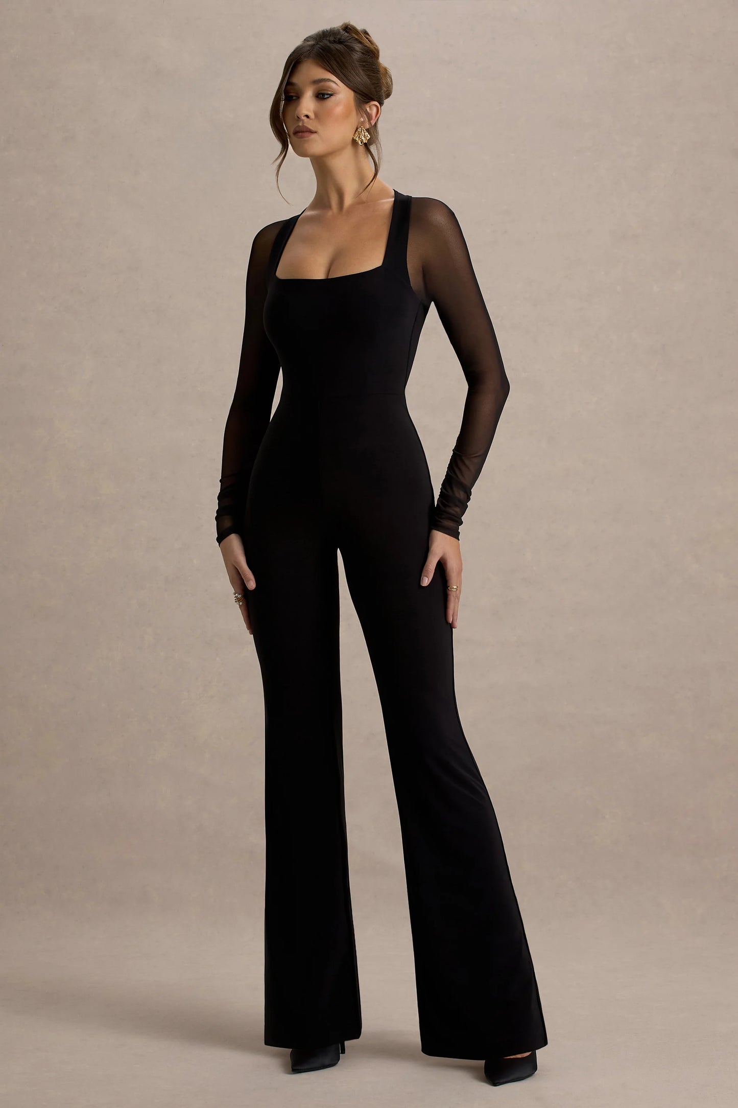 On Track Black Flared-Leg Jumpsuit With Sheer Sleeves