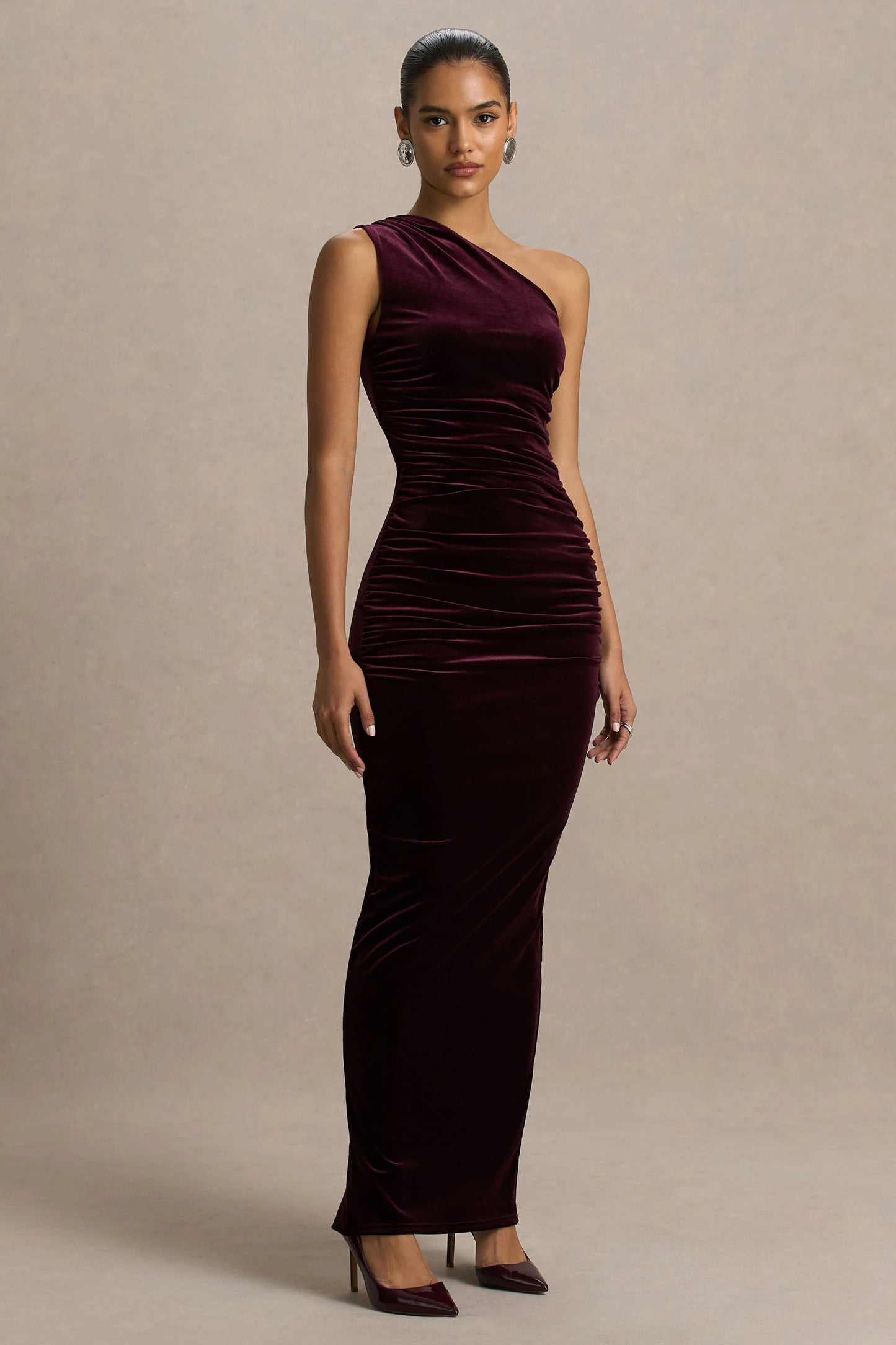 Treat Burgundy Velvet Asymmetric-Neck Maxi Dress With Ruched Detailing.