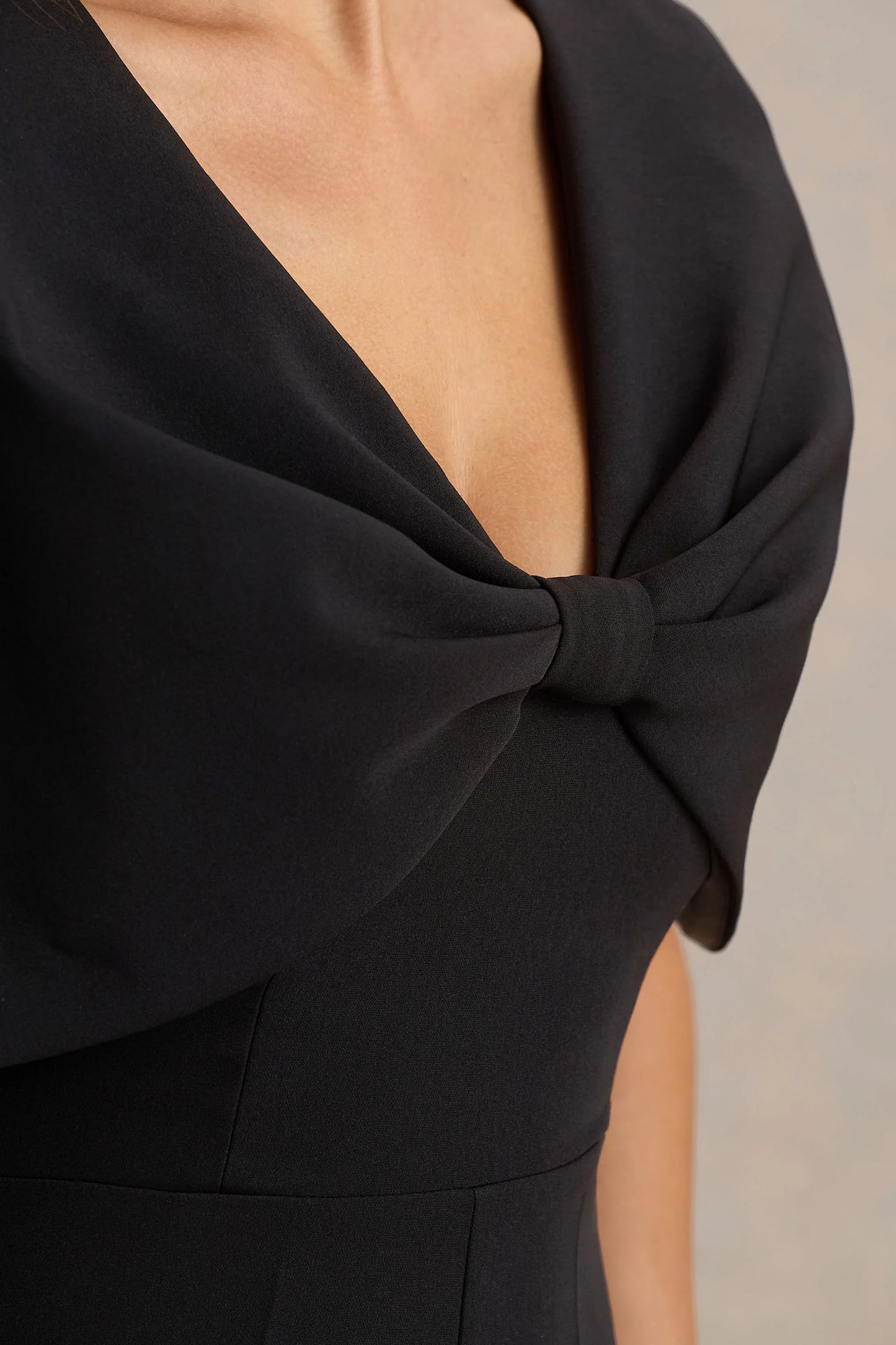 Vivid Black Plunge-Neck Jumpsuit With Bow-Detail