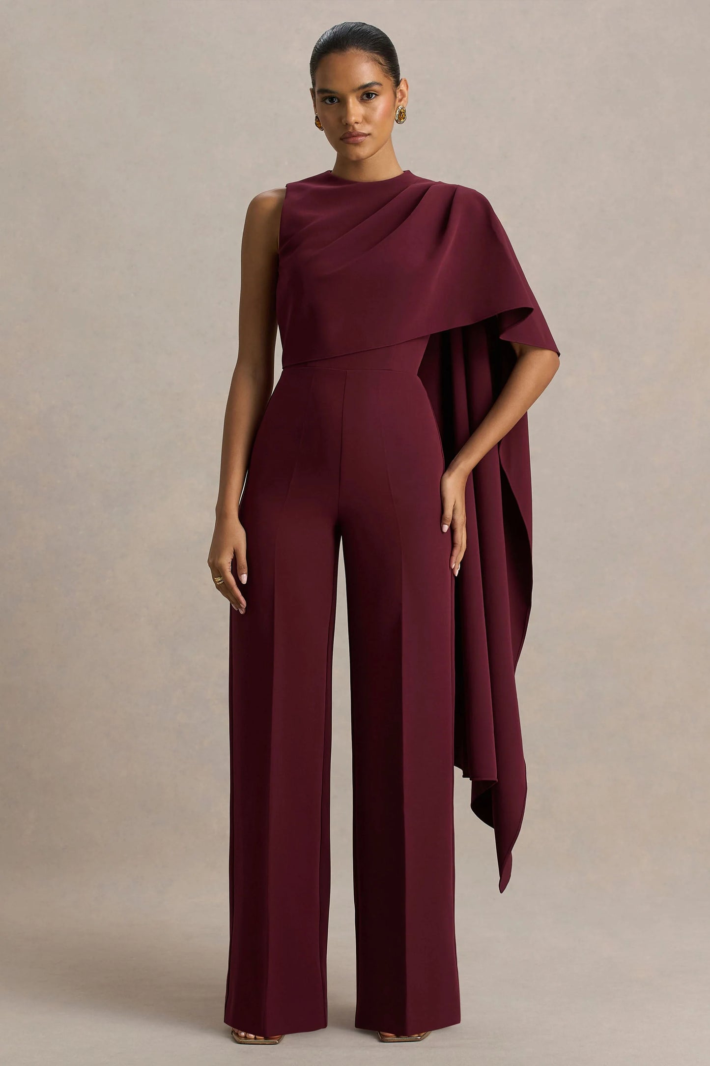 Sorenia Burgundy High-Neck Jumpsuit With One-Cape Sleeve